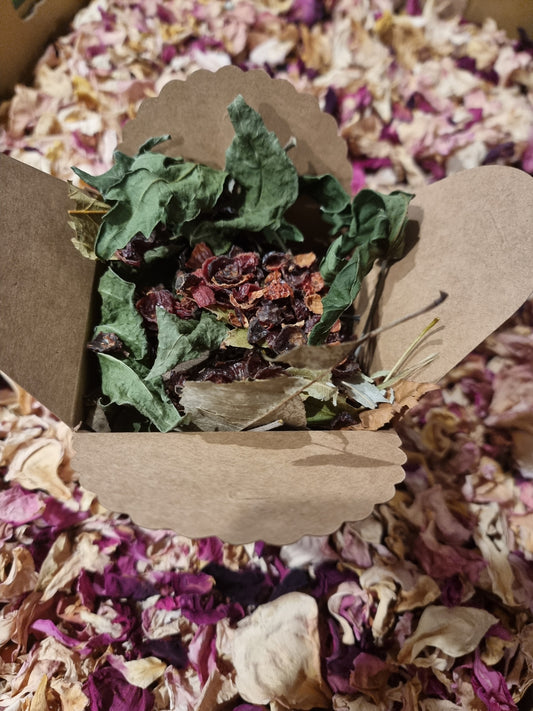 Box with dried leaves and dried rosehips